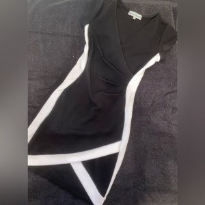 black bodycon dress with white contour stripe. size: s   comfortable & chique